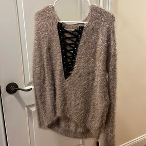 Long sleeve lace up fuzzy sweater